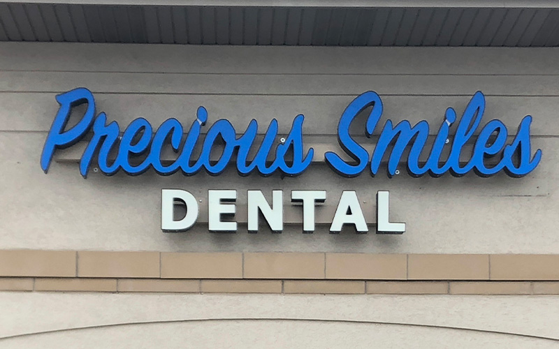 Exterior wall sign for Precious Smiles Dental